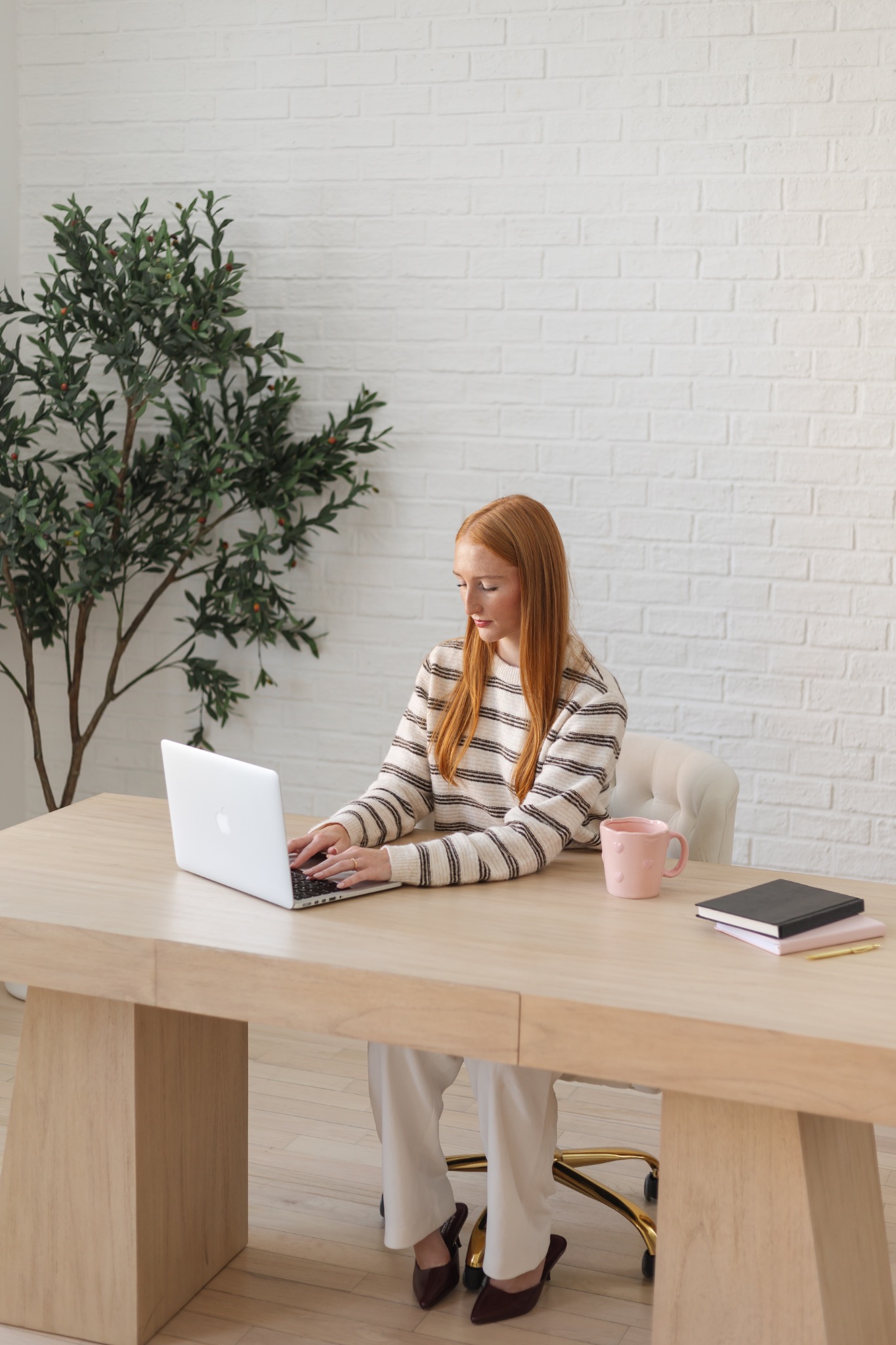 Claire working at her desk